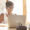 Young female watching or working on laptop