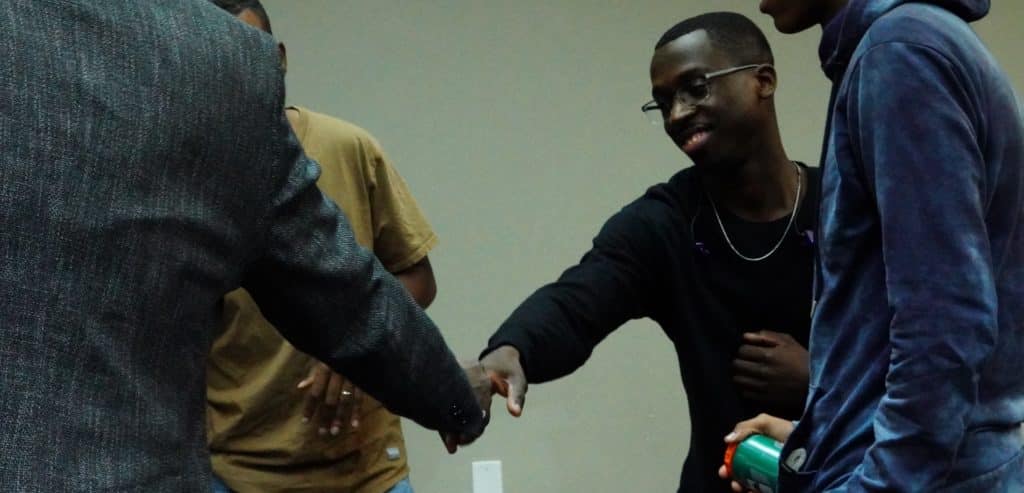 Young men greeting each other at Generations Church